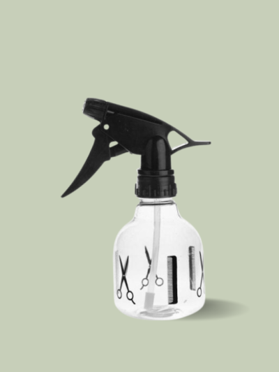 A transparent spray bottle with black nozzle